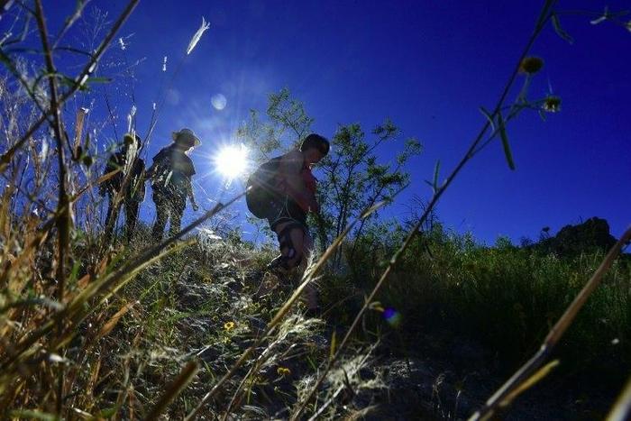 Volunteers hike into the borderlands of Arizona, and leave water behind for migrants as many die of dehydration or, in winter, hypothermia