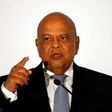 Finance Minister Pravin Gordhan gestures during his address at a business summit in Sandton, South Africa, September 13, 2016