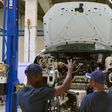 Technicians work on a Polo Vivo at a new assembly plant in Kenya's Thika industrial area, on December 21, 2016