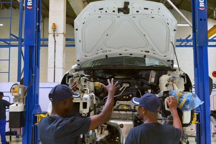 Technicians work on a Polo Vivo at a new assembly plant in Kenya's Thika industrial area, on December 21, 2016