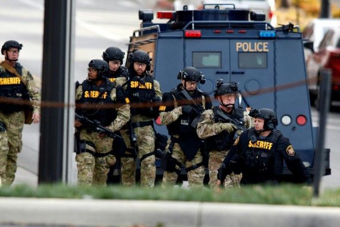 Law enforcement officials are seen outside of a parking garage on the campus of Ohio State University as they respond to an attack in Columbus, Ohio, on November 28, 2016