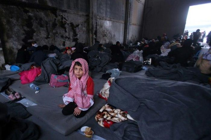 A Syrian boy, who fled with his family from rebel-held areas in the city of Aleppo, sits on November 30, 2016, inside a shelter in the neighbourhood of Jibrin, east of Aleppo