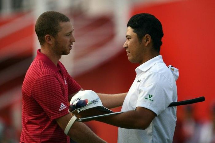 Hideki Matsuyama (R) of Japan and Daniel Berger of the US shake hands after the final round of the World Golf Championships-HSBC Champions tournament in Shanghai on October 30, 2016