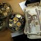 Kenya shilling coins and notes are pictured inside a cashier's booth at a forex exchange bureau in Kenya's capital Nairobi, April 20, 2016. REUTERS/Thomas Mukoya