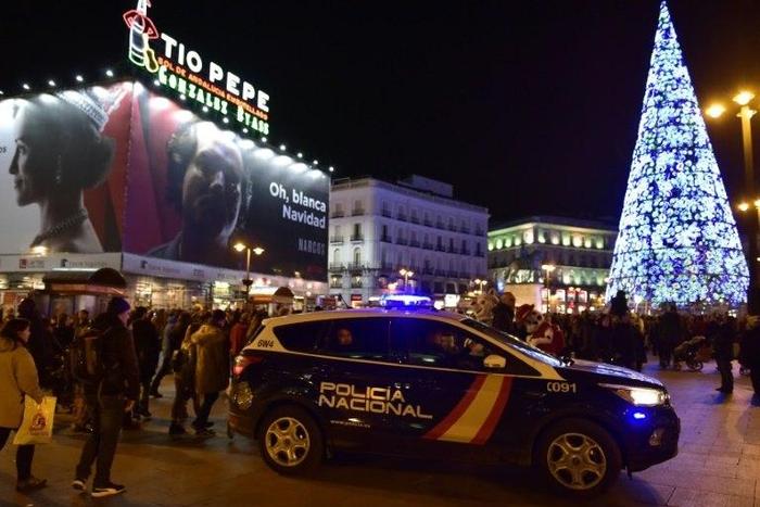 A police vehicle patrols on Plaza del Sol in the centre of Madrid on December 23, 2016