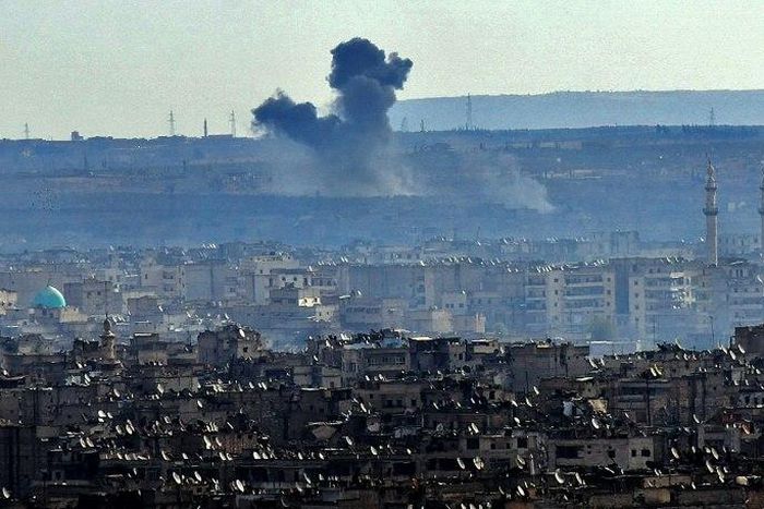 Smoke billows from the southern suburbs of Aleppo during fighting between regime forces and rebel fighters on December 3, 2016