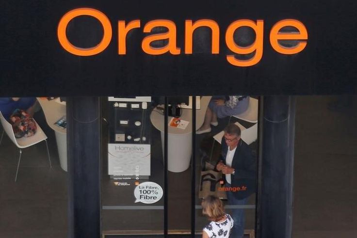 The Orange telephone company logo is seen in front of a shop in Paris, France
