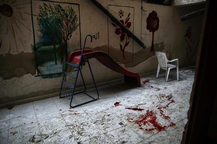 The blood-stained floor of a kindergarten following reported shelling in the rebel-held area of Harasta, on the northeastern outskirts of Damascus, on November 6, 2016