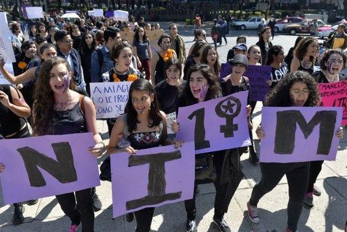 Women in Mexico City take part on October 19, 2016 in a march in solidarity for the brutal killing of a 16-year-old girl in Argentina