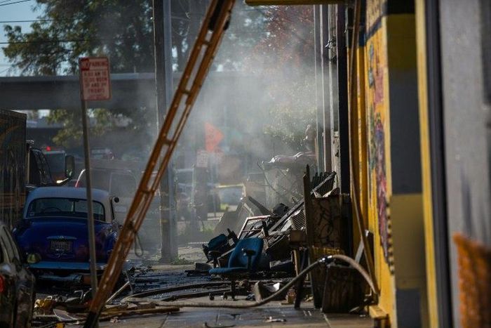 A warehouse smoulders after it was destroyed by a fire, December 3, 2016 in Oakland, California