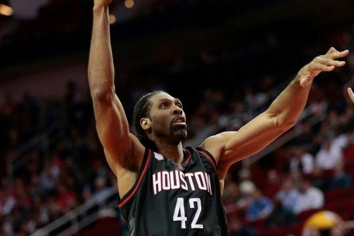 Nene Hilario of the Houston Rockets drives to the basket against the Oklahoma City Thunder, at Toyota Center in Houston, Texas, on January 5, 2017