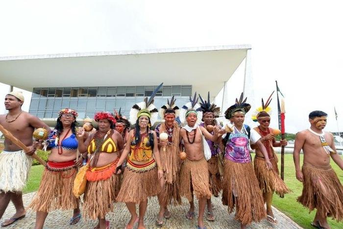 Indigenous people occupy the outer galleries of the presidential palace in protest against industries that threaten their livelihood, in Brasilia on November 22, 2016