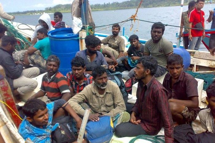Australia-bound Sri Lankan asylum-seekers are seen off western Sumatra, after being intercepted by Indonesian authorities