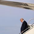 Republican presidential nominee Donald Trump steps off of his airplane at Detroit Metropolitan Wayne County Airport before heading to a campaign rally in Warren October 31, 2016 in Romulus, Michigan