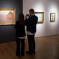 Journalists take a video of "Meule" by Claude Monet in New York during a press preview at Christie's
