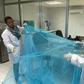 Workers look for holes in mosquito netting at the A to Z Textile Mills factory producing insecticide-treated bednets in Arusha, Tanzania, May 10, 2016.