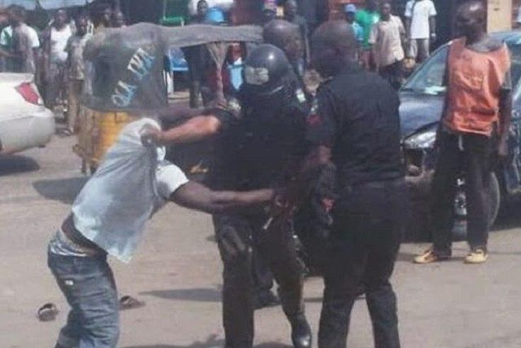 A man fighting with police officers (Illustration)