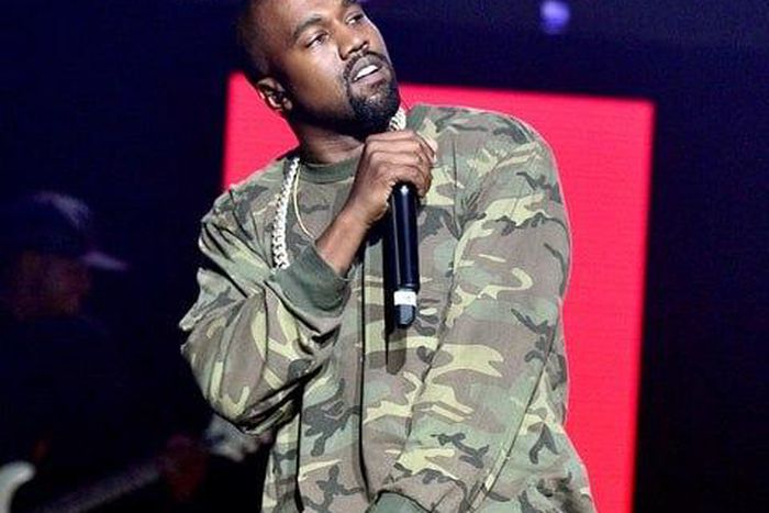 Kanye West performing during a concert