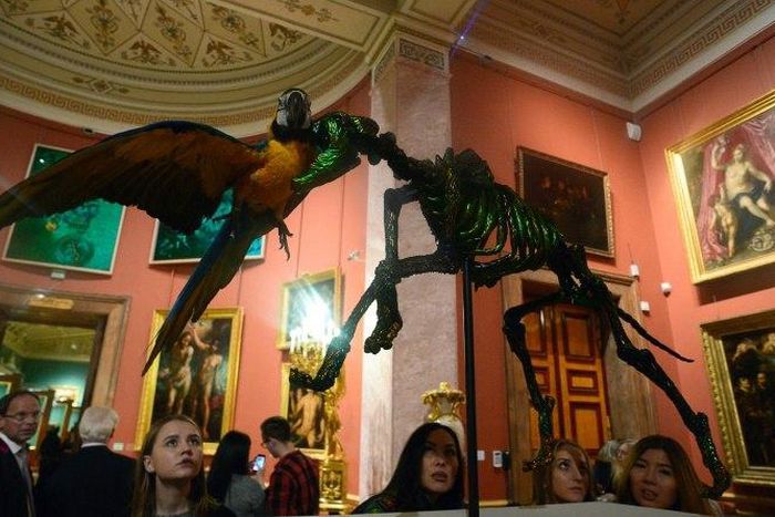 Visitors look at Belgian artist Jan Fabre's work "Fidelity and the repetition of death" during the exhibition "Knight of Despair Warrior of Beauty" at the Hermitage museum