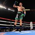 Joe Smith Jr. reacts after punching Bernard Hopkins out of the ring for a ninth round TKO to win the WBC International Light Heavyweight title, at The Forum in Inglewood, California, on December 17, 2016
