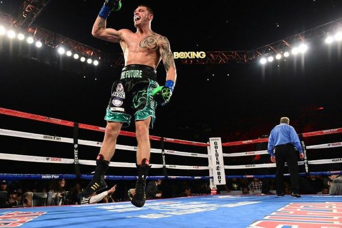 Joe Smith Jr. reacts after punching Bernard Hopkins out of the ring for a ninth round TKO to win the WBC International Light Heavyweight title, at The Forum in Inglewood, California, on December 17, 2016