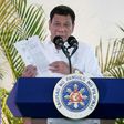 Philippine President Rodrigo Duterte delivers a speech at Davao airport on the southern island of Mindanao on November 17, 2016