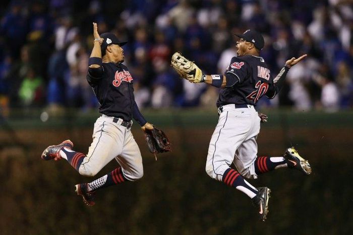 Francisco Lindor and Rajai Davis of the Cleveland Indians celebrate after beating the Chicago Cubs 7-2 in Game Four of the 2016 World Series