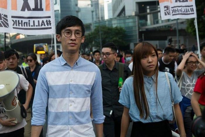 Baggio Leung (L) and Yau Wai-ching of the Youngspirations organisation march during a protest in Hong Kong, on November 6, 2016