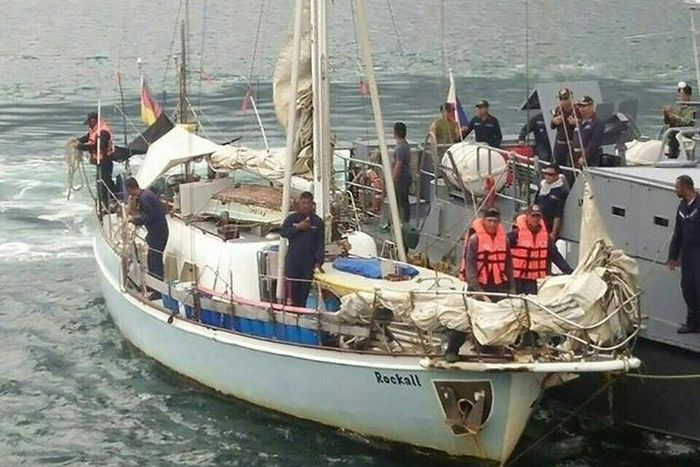 Philippine navy personnel stand onboard the yatch Rockall, where the body of a naked white woman who had been shot was found was aboard, after it was recovered off Laparan island, in Sulu province