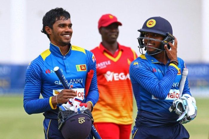 Sri Lanka's Dhananjaya de Silva (left) and Kusal Mendis walk off the pitch after victory against Zimbabwe in Harare on November 14, 2016