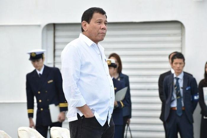 Philippine President Rodrigo Duterte inspects Japan's coast guard drills in Yokohama on October 27, 2016