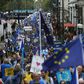 People carry EU flags during a March for Europe protest against the Brexit vote in London in September 2016