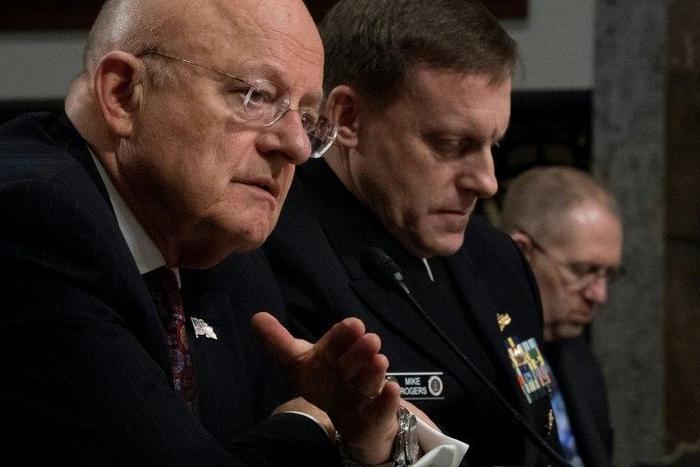 Director of National Intelligence James Clapper (L) and National Security Agency Director Admiral Michael Rogers (C) testify before the Senate Armed Services Committee