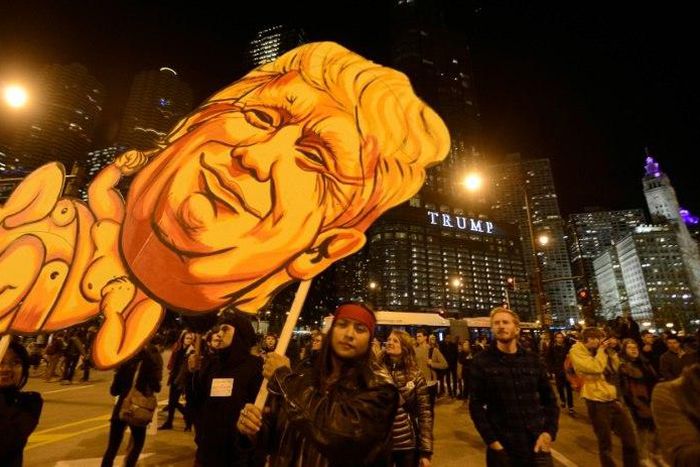 Demonstrators take part in a protest near Trump Tower in Chicago on November 9, 2016
