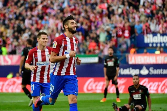 Yannick Carrasco scored a hat-trick in a 7-1 rout for leaders Atletico Madrid over Granada at the Vicente Calderon stadium on October 15, 2016