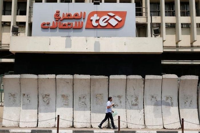 A man walks in front of the main Telecom Egypt building at the center of downtown in Cairo, Egypt August 16, 2016.  REUTERS/Amr Abdallah Dalsh