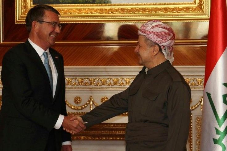 Iraqi Kurdish leader Massud Barzani (R) shakes hands with US Secretary of Defence Ashton Carter ahead of a meeting on October 23, 2016 in Arbil