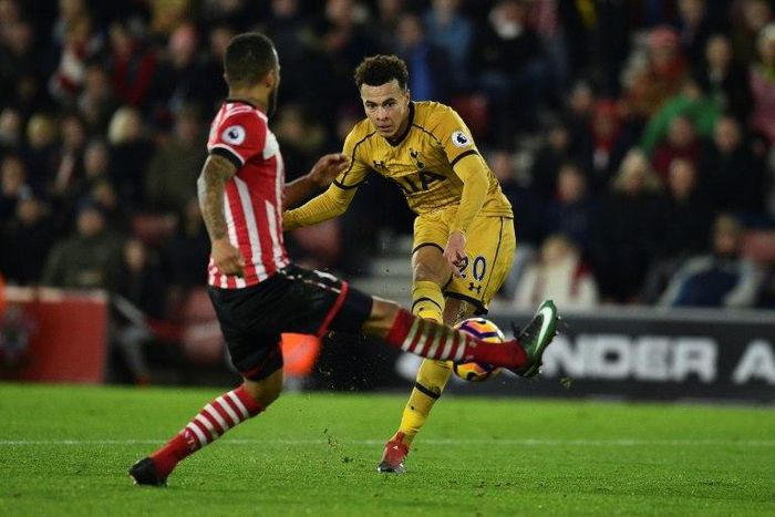 Tottenham Hotspur's midfielder Dele Alli (R) scores their fourth goal during the English Premier League football match between Southampton and Tottenham Hotspur at St Mary's Stadium in Southampton, southern England on December 28, 2016