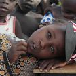 A girl displaced as a result of Boko Haram attack in the northeast region of Nigeria, rests her head on a desk at Maikohi secondary school camp for internally displaced persons (IDP) in Yola, Adamawa State January 13, 2015.