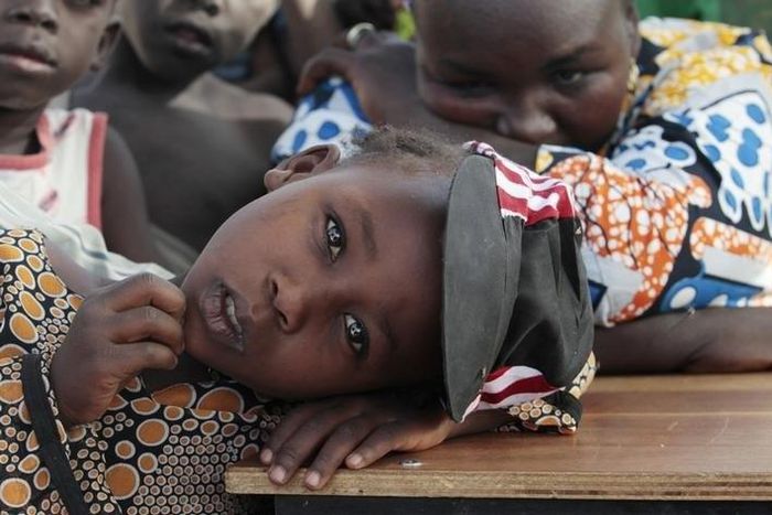 A girl displaced as a result of Boko Haram attack in the northeast region of Nigeria, rests her head on a desk at Maikohi secondary school camp for internally displaced persons (IDP) in Yola, Adamawa State January 13, 2015.