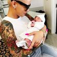 Amber Rose cradling Dream Renee Kardashian