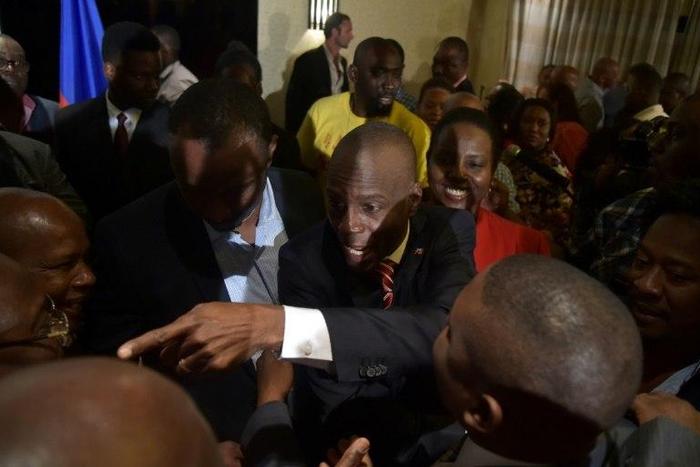 Elected President Jovenel Moise (C) of the PHTK party, greets supporters after speaking to the nation, in the Haitian capital Port-au-Prince