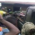 People gather around a truck transporting the victims of a wave of unrest and violence in Beni, Democratic Republic of Congo, in August 2016