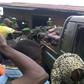 People gather around a truck transporting the victims of a wave of unrest and violence in Beni, Democratic Republic of Congo, in August 2016