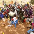 People who were rescued after being held captive by Boko Haram, sit as they wait for medical treatment at a camp near Mubi, northeast Nigeria October 29, 2015.    REUTERS/Stringer
