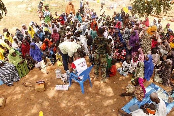 People who were rescued after being held captive by Boko Haram, sit as they wait for medical treatment at a camp near Mubi, northeast Nigeria October 29, 2015.    REUTERS/Stringer