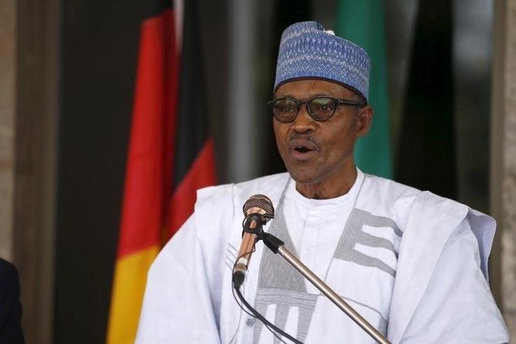 Nigerian President Muhammadu Buhari speaks during German President Joachim Gauck's visit to the State House in Abuja