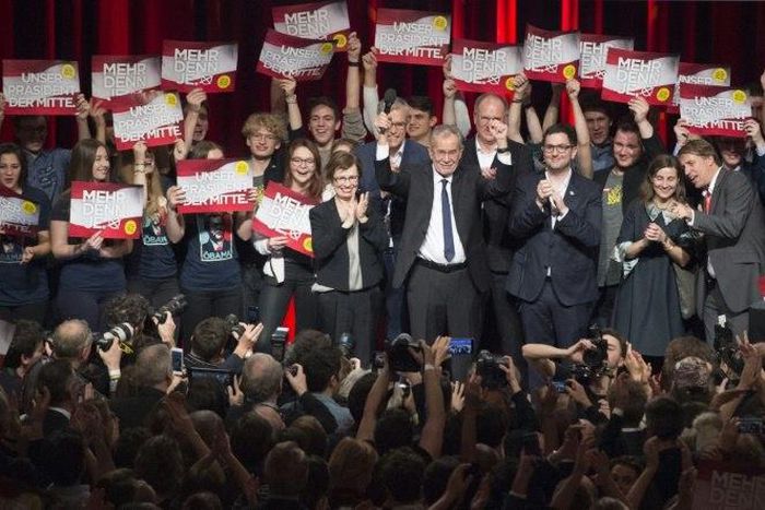 Austrian Presidential candidate Alexander Van der Bellen celebrates with supporters at a post-election event in Vienna on December 4, 2016