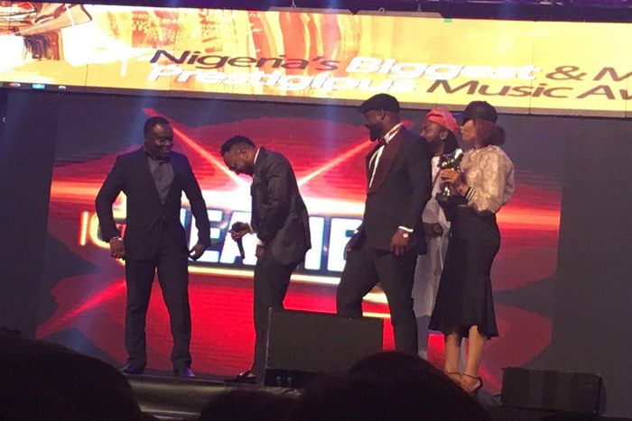 Kcee, Harysong on stage at the Headies 2016.