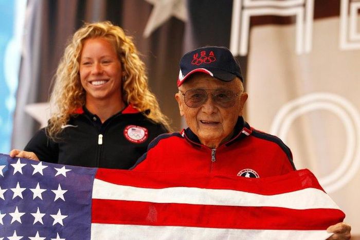US 1948 and 1952 Olympic platform diving gold medalist Dr. Sammy Lee, who died of pneumonia complications at age 96, is seen with Olympic diving hopeful Brittany Viola of the United States in 2012
